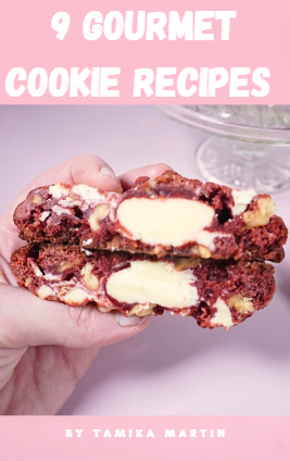 A red velvet cookie cut in half with a cream cheese centre