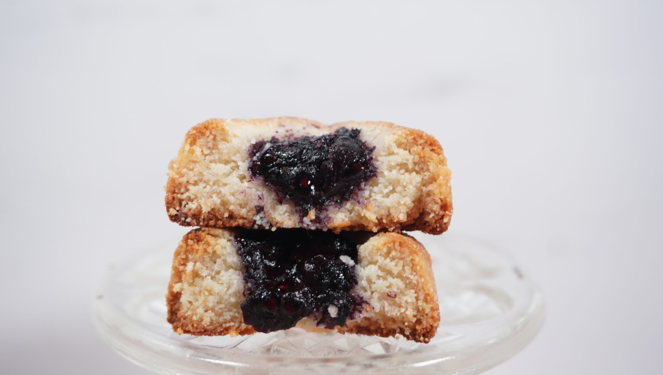 A Paleo Thumbprint Cookie cut in half