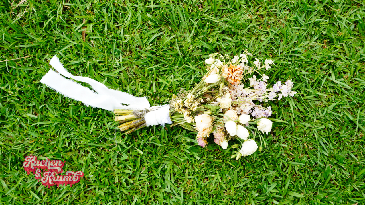 Wedding Bouquet with purple flowers on grass